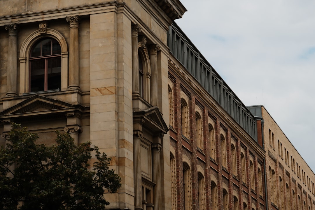 a-tall-building-with-a-clock-on-the-top-of-it-fwvtez8wgoe